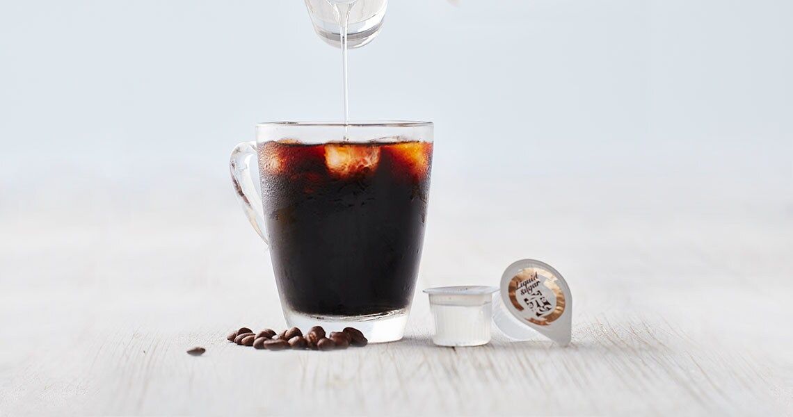 liquid sugar poured in coffee image